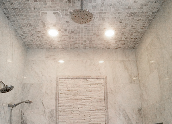 white-carrera-marble-shower